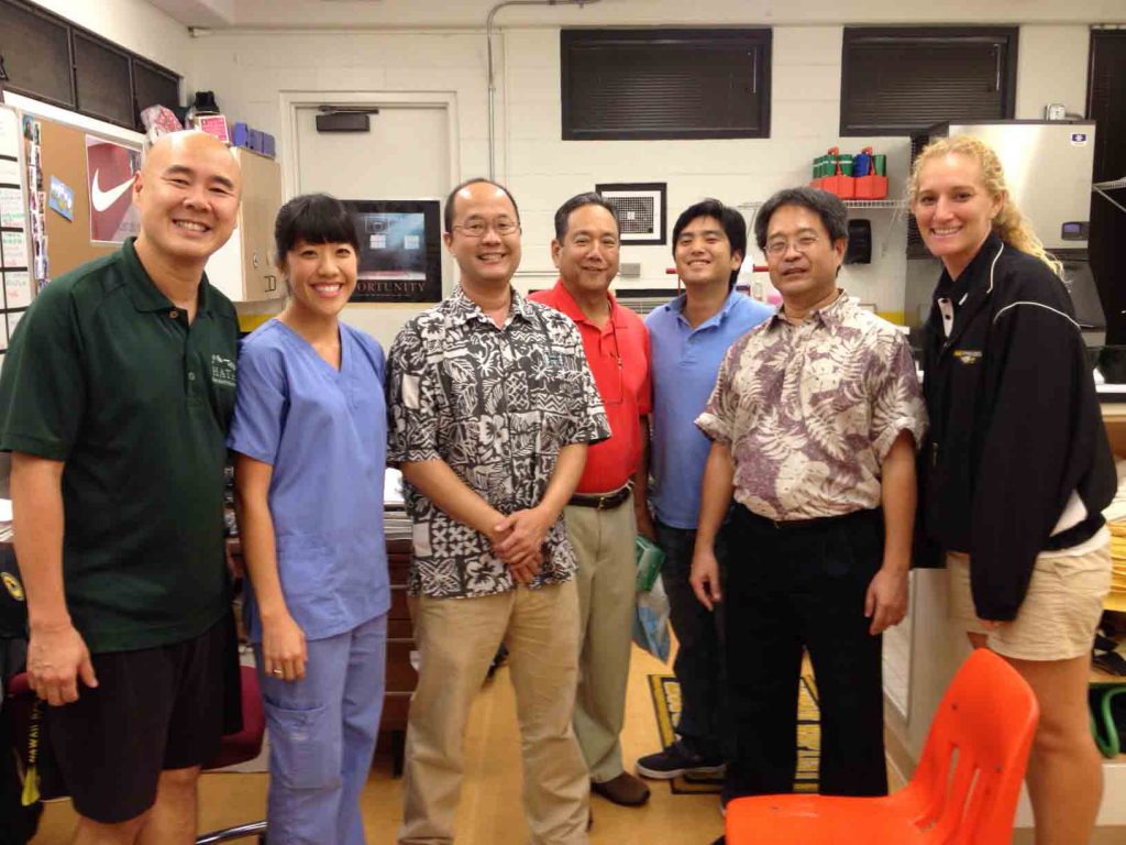 From left to right: Sam Lee, HBA Athletic Trainer; Elise Chong, dental student; Dr. Steve Kumasaka; Dr. Dean Sueda; Stephen Sueda ('04), dental residency student; Dr. Dwayne Sakata; and Shannon Keen, HBA Athletic Trainer. Photo by Deren Oshiro.